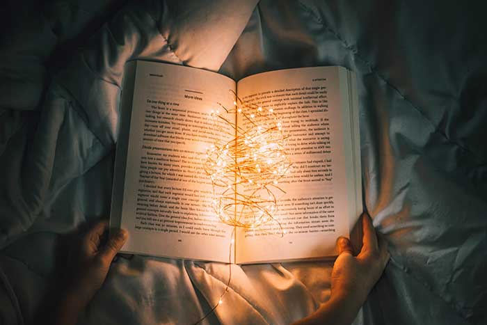 photo of book & lights by californong @ unsplash.com