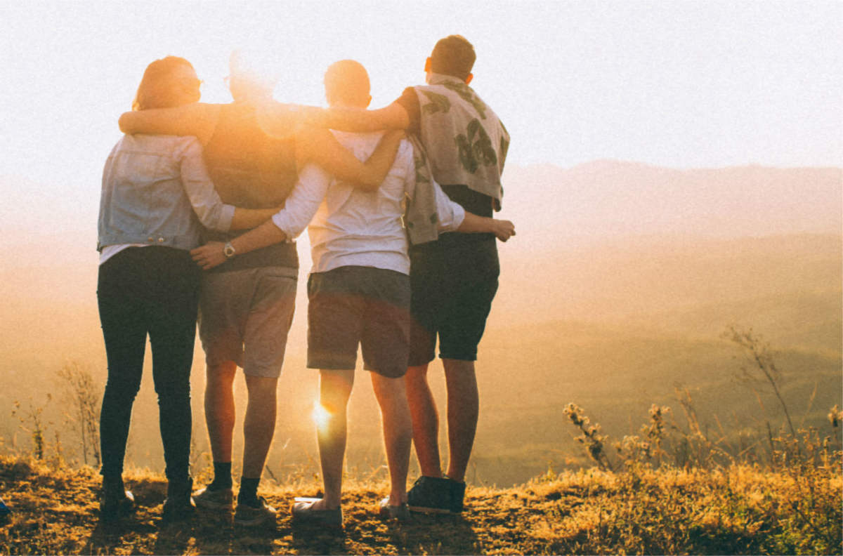 friends looking at sunset