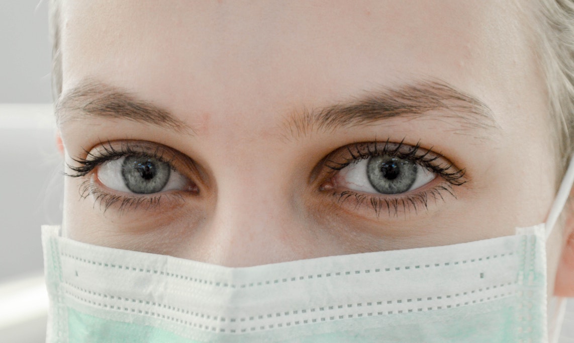 photo of nurse's eyes above mask